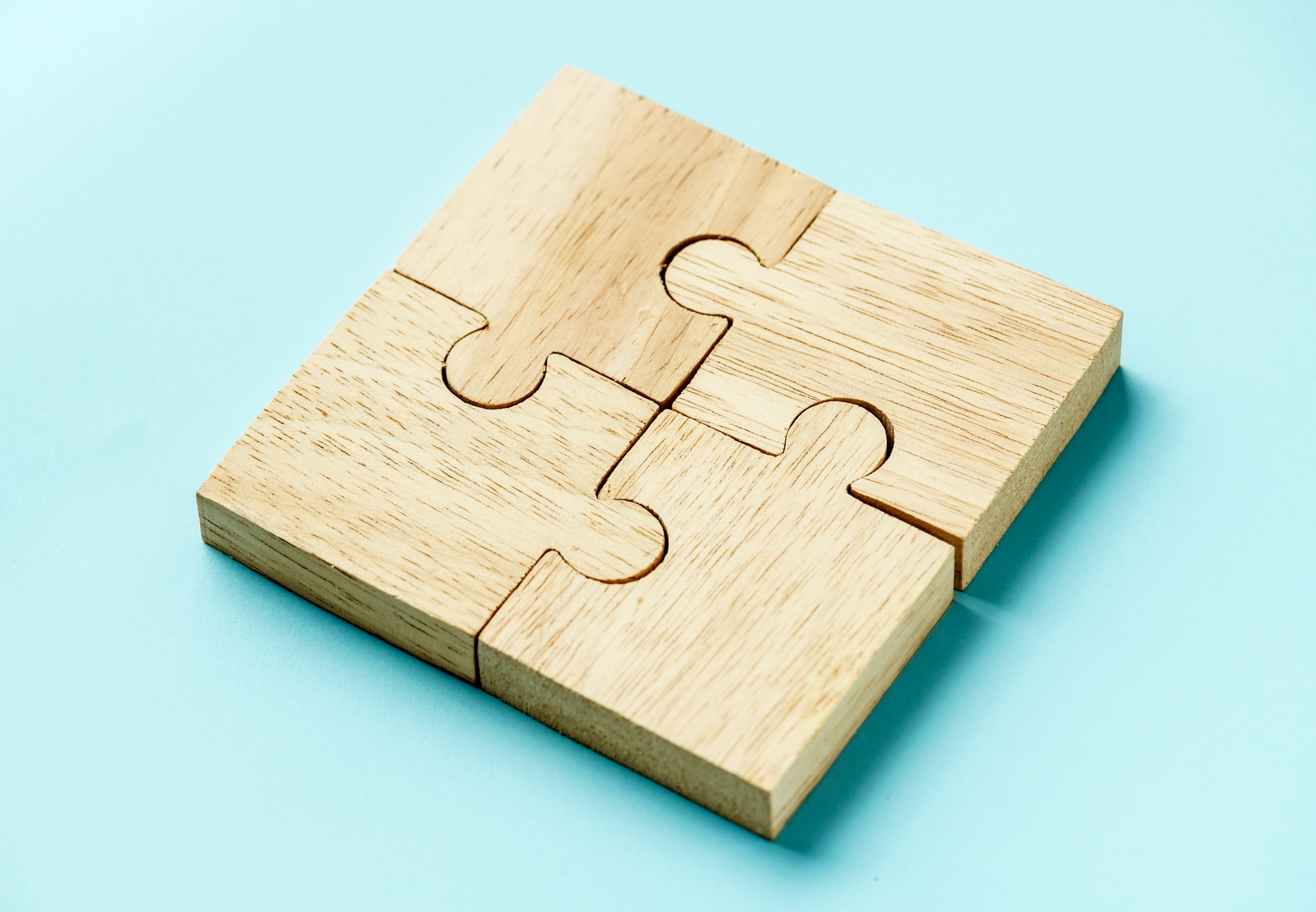 Four puzzle pieces fit perfectly together