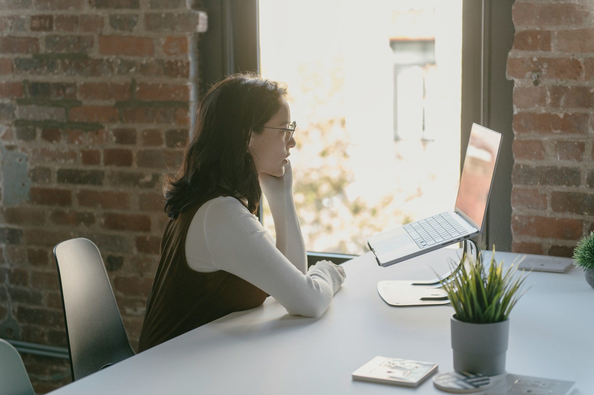 A woman in a Zoom meeting receiving online training for how to apply for more government contracts